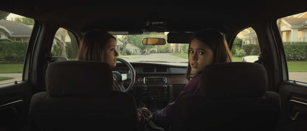 AI image of kids in car created in KlingAI